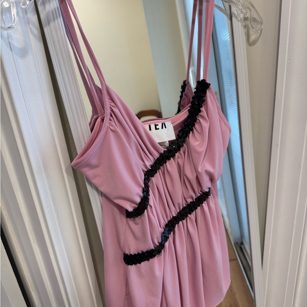 Very cute pink top. Women's size 6 but is stretchy material.